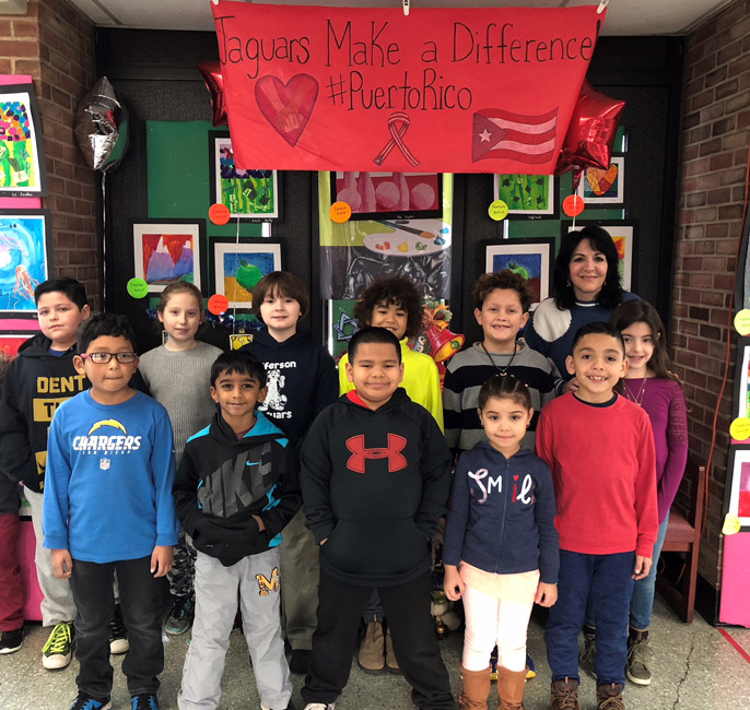 Jefferson teacher Maria Mazzola with the school's Artists of the Month for December.