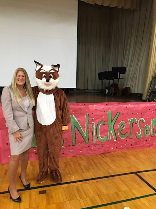 Interim Flower Hill Principal Paula Nickerson with the Flower Hill fox.