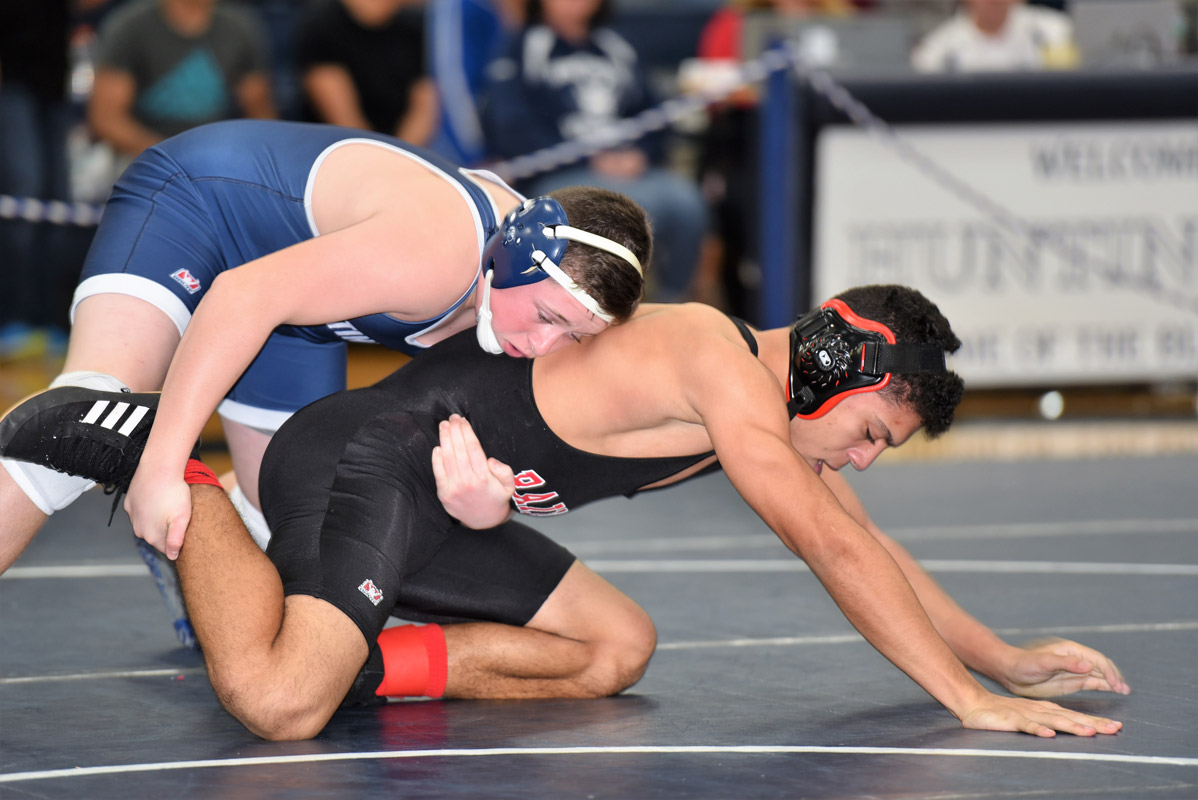 Finley eighth grader Robbie Smith (top) was impressive in his varsity debut.