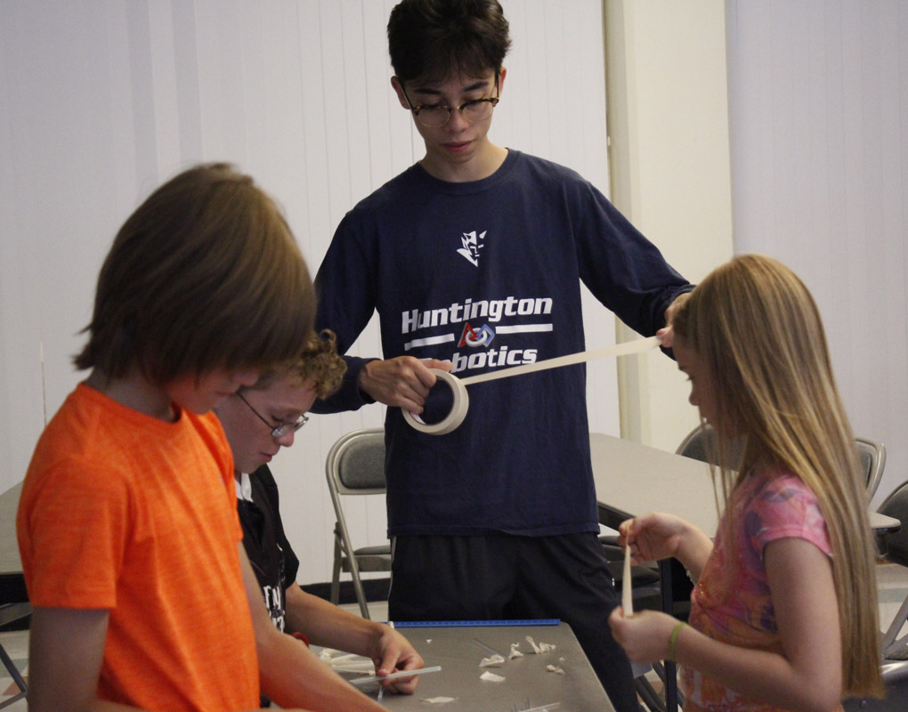 Robotics team members worked closely with the STEM Academy participants
