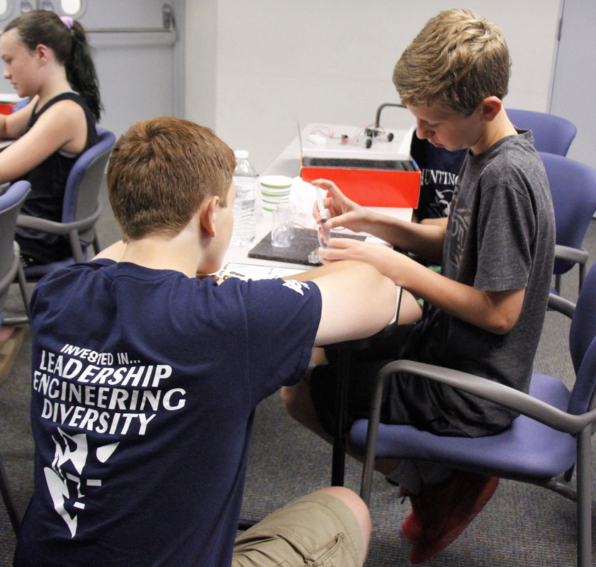 Robotics team members worked closely with the STEM Academy participants