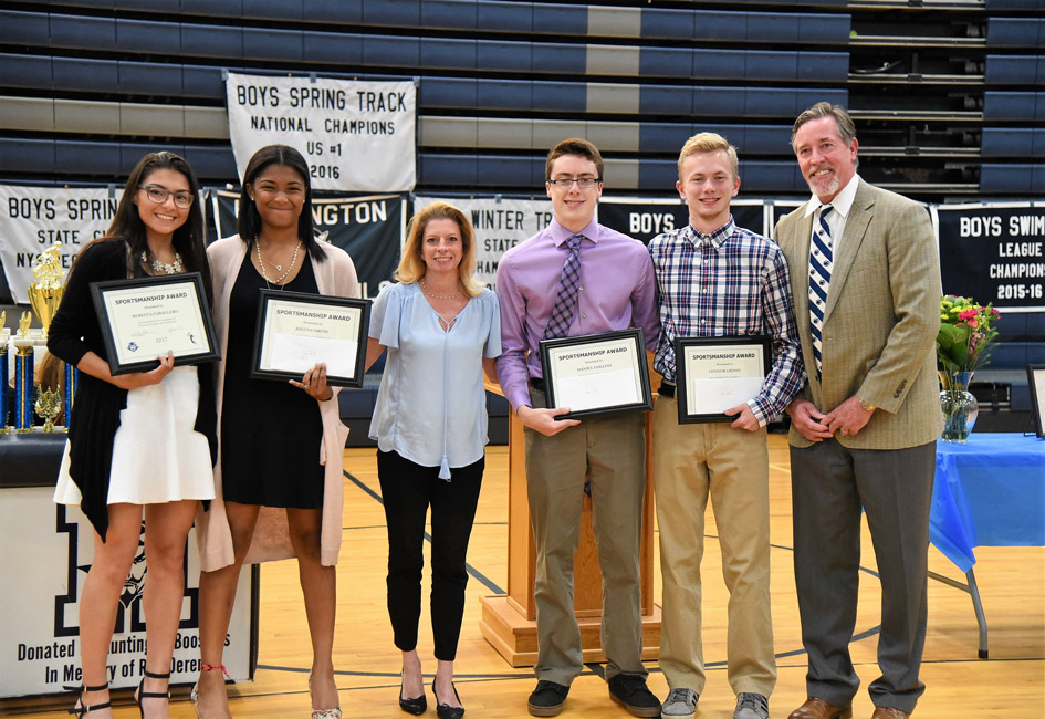Huntington Booster Club officials with this year's sportsmanship scholarship recipients.