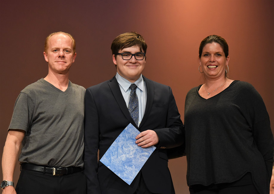 Schaeffer scholarship recipient Jackson Kent is flanked by Sean and Kim Schaefer.