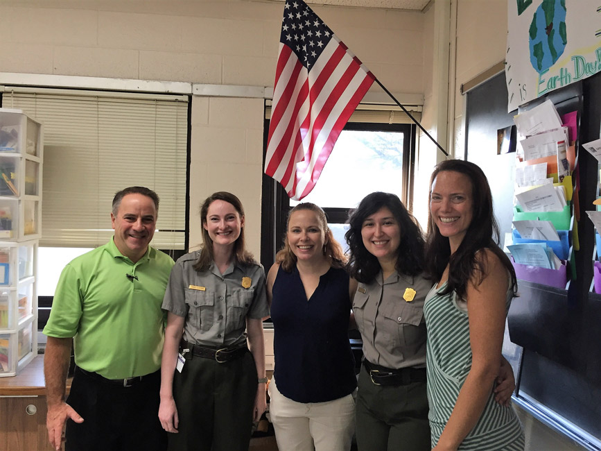 Chair of Humanities Joseph Leavy with Sagamore Hill National Park Service rangers Finley teachers.