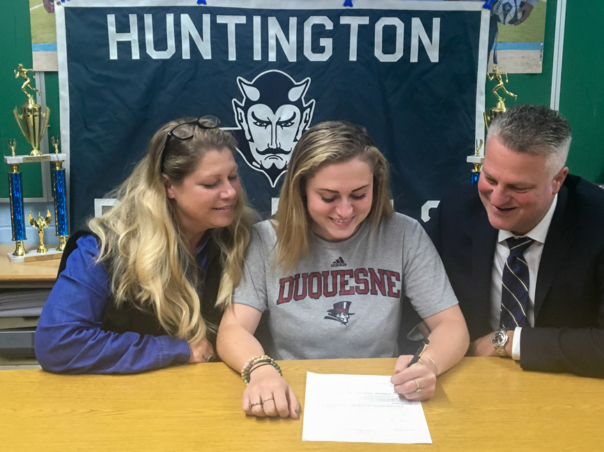 Sarah Agrillo is flanked by her parents, Lyndia and Ted