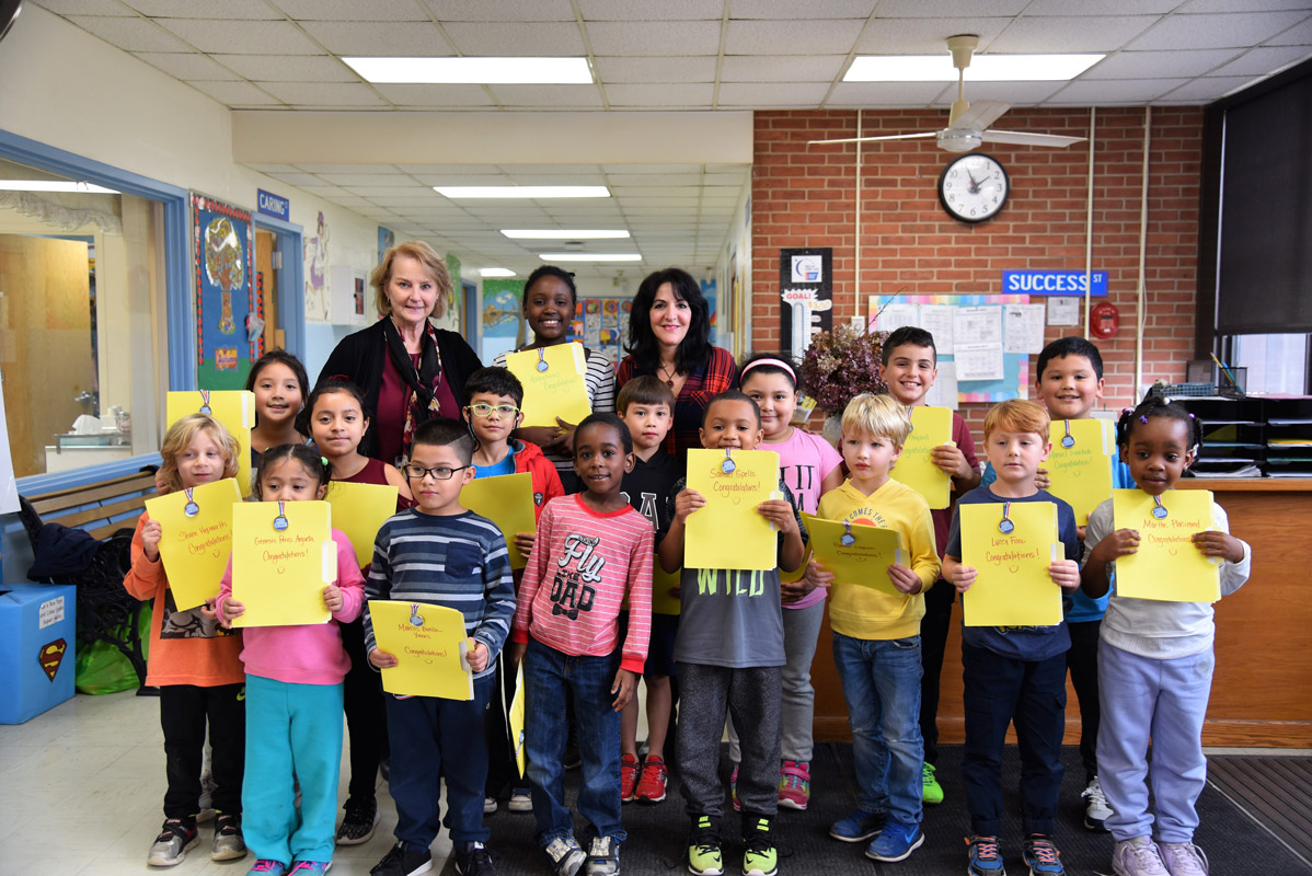 Principal Marsha Neville and teacher Maria Mazzola with November's Featured Artists.