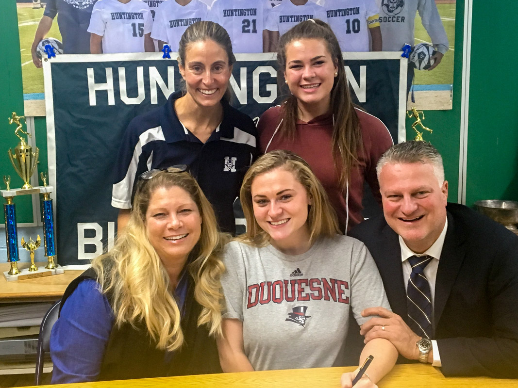 Sarah Agrillo is surrounded by her parents, Lyndia and Ted, lax coach Kim Gilroy and sister Megan.