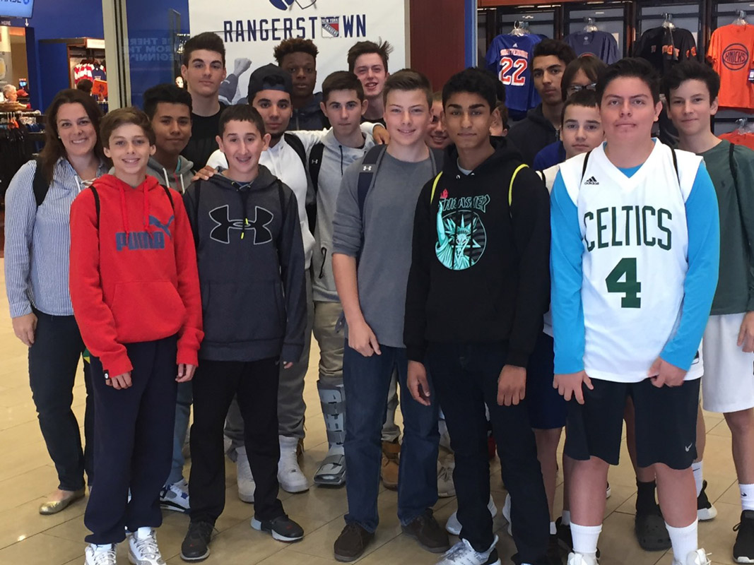 Huntington teacher Paige Tyree with her sports marketing class students at MSG. 