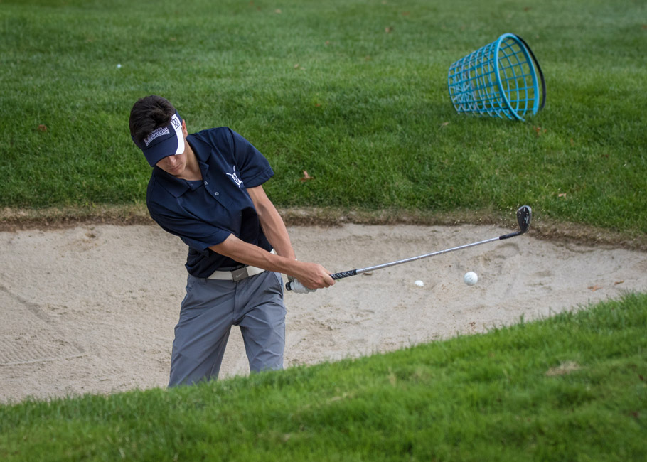Matt Giamo works on getting out of a sand trap. 