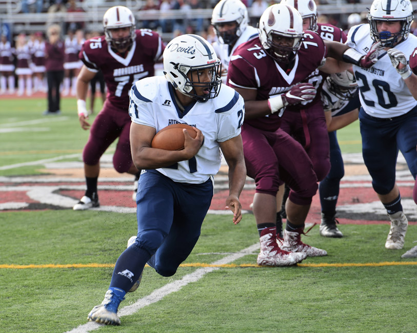 Huntington junior Eric Sands put the moves on Bay Shore's defense.