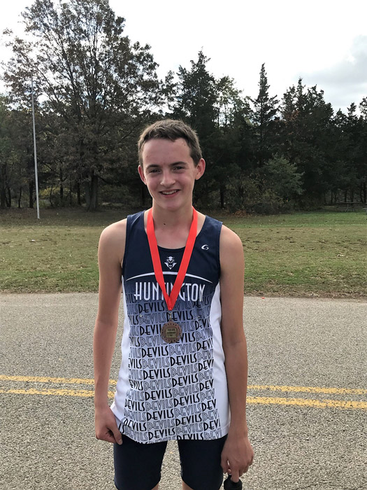 Blue Devil sophomore Jason Verville with his Suffolk cross country medal.