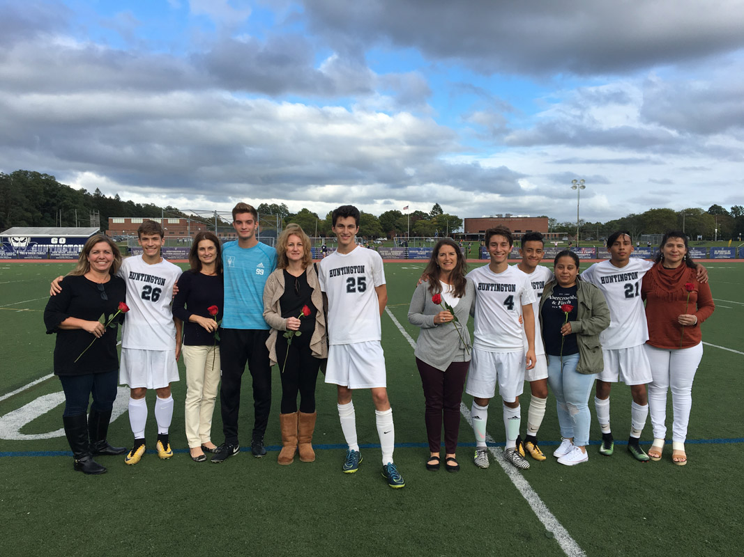 Blue Devil boys' soccer players and their mom's on Senior Day.