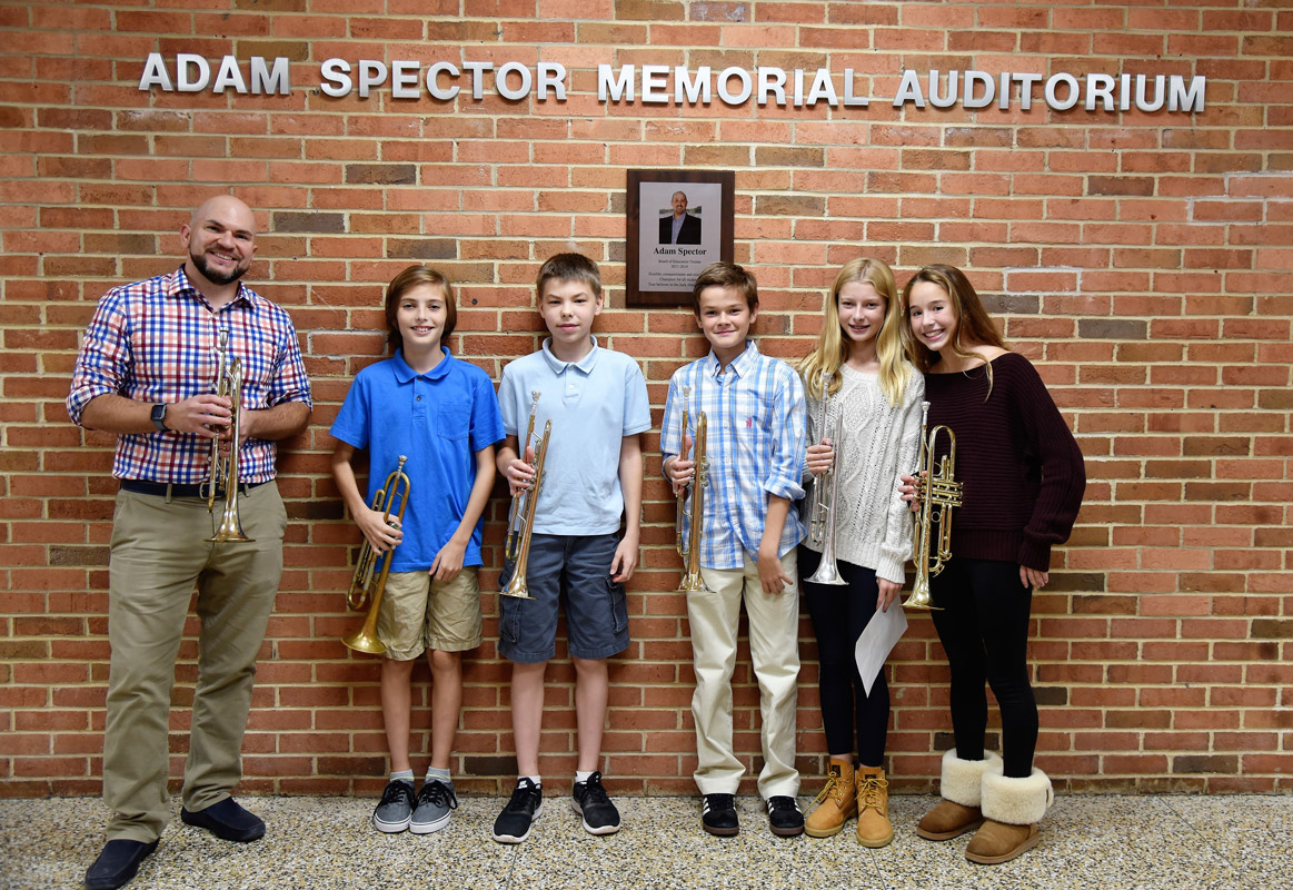 Finley music teacher Frank Batista with five sensational trumpeters. 