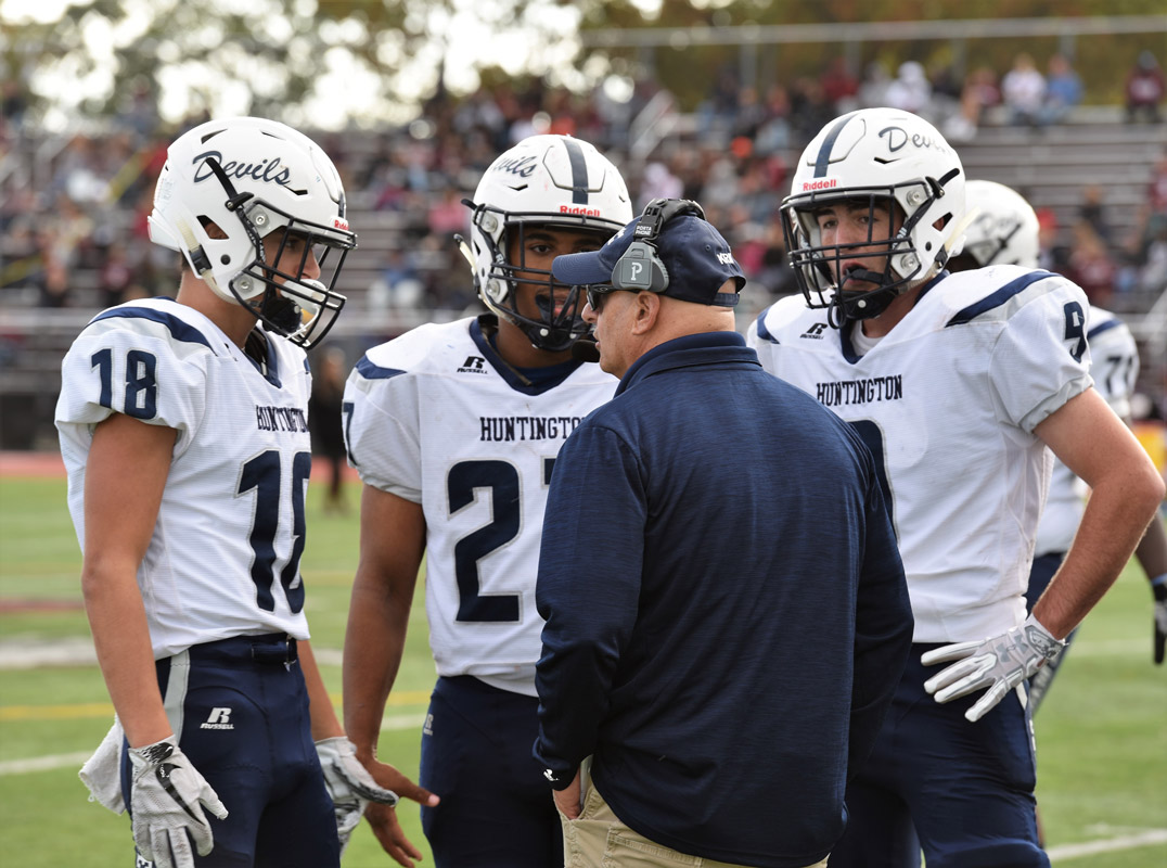 Huntington head coach Steve Muller talks things over with his players.