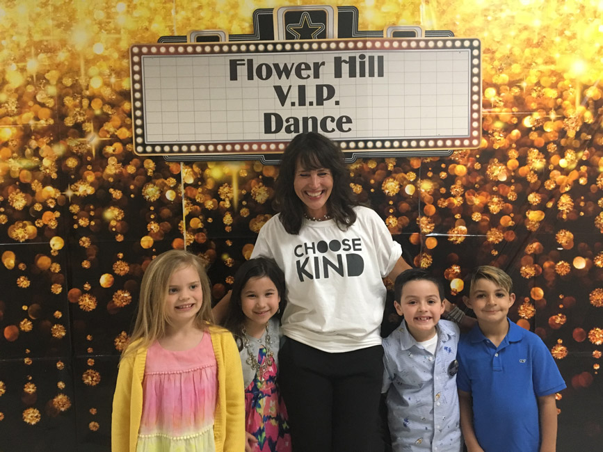 Flower Hill Principal Lucia Laguarda with students at last Friday night's dance.