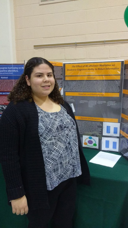 Huntington sophomore Claudia Villatoro with her research findings.