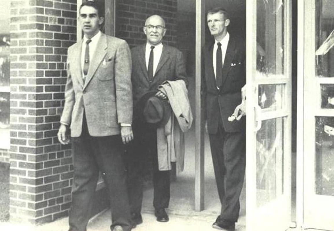 Don Loughlin (right) exiting the new high school after a final pre-opening tour.