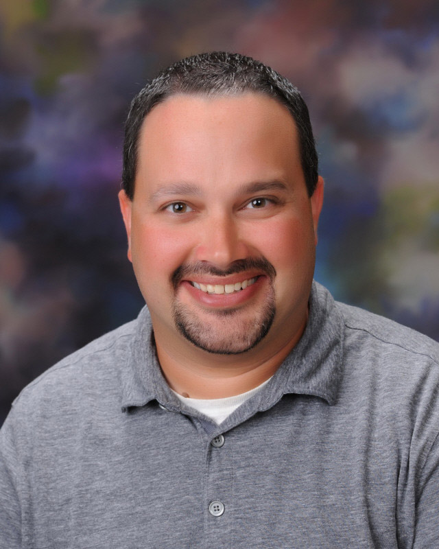Huntington music teacher Brian Stellato is coordinating the summer arts program.