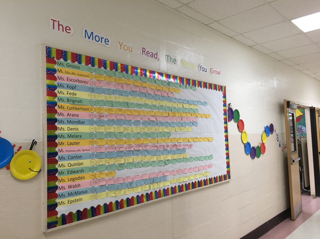 Colorful bulletin boards promoted the month long pick-a-partner reading program
