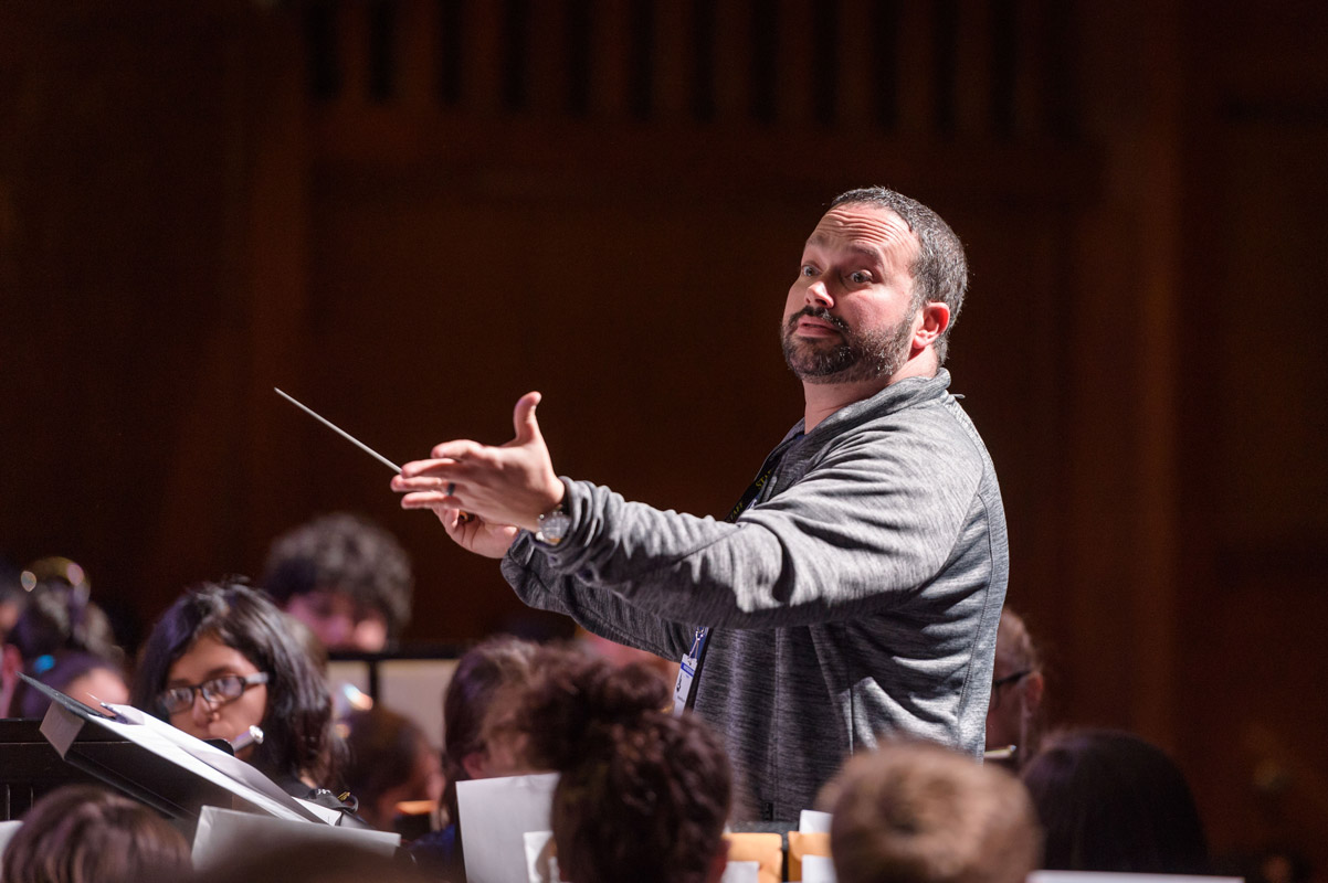 Huntington High School band director Brian Stellato works with Band Fest participants. (Darin Reed photo (3)
