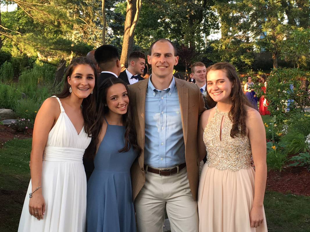 Lauren White, Serina Aguirre, teacher Ken Donovan and Katharine Kitzen at last year's prom.