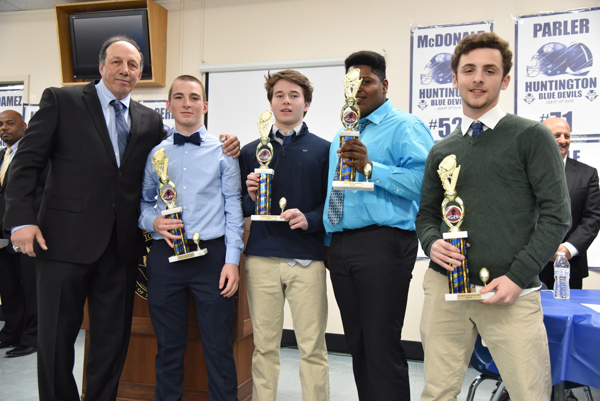 Coach Jim Byrnes with Huntington JV football's top players at the program's awards dinner.
