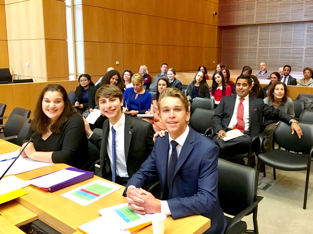 Huntington's attorneys Alyssa Befumo, Max Robins and John Panos at US District Court in Central Islip.