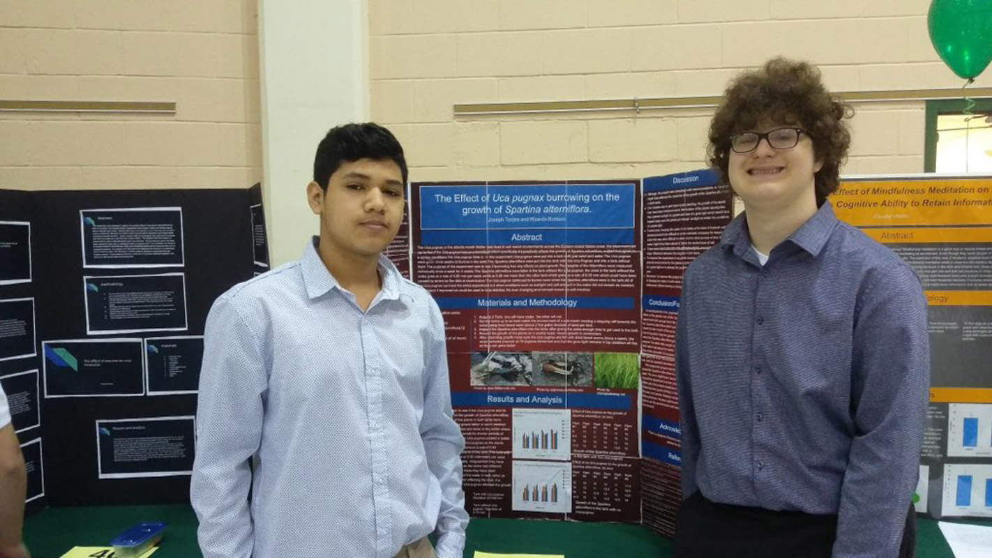 Ricardo Romero-Cisneros and Joe Tonjes with their project at Farmingdale State College.