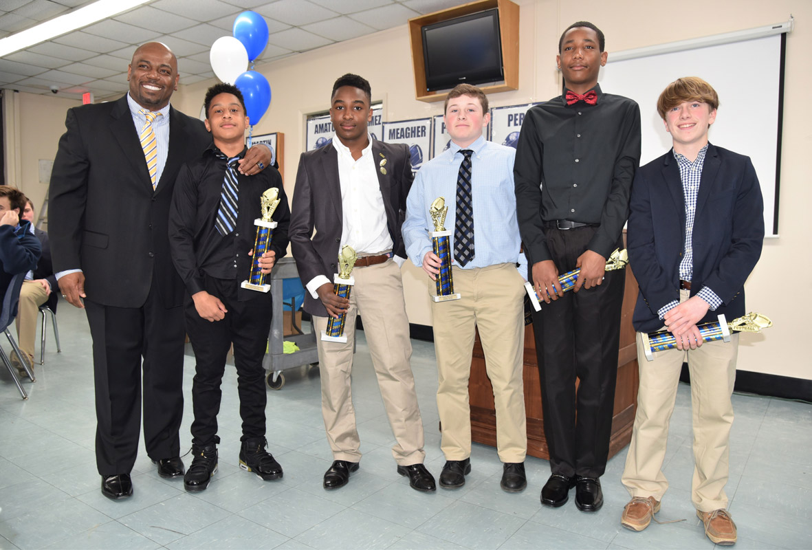 Coach Ron Wilson with Finley's top eighth grade football players at the program's award dinner.