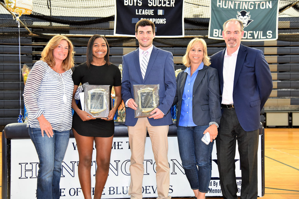 Nicole Leslie and Luke Eidle with members of Courtney O'Bryan's family at the scholarship presentation