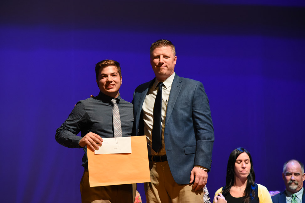Huntington High School Principal Brenden Cusack presented the Technology Award to John Riley