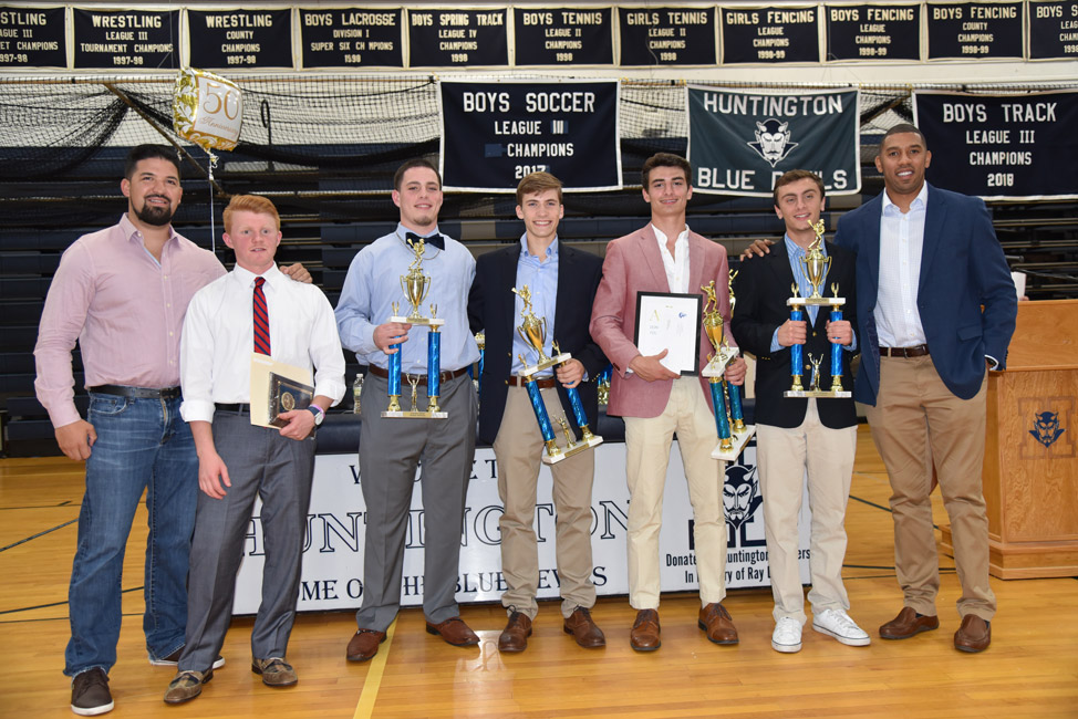 Alex LaBella (third from right) holds the Boys' Lax Founders Award alongside the top seniors and their coaches.