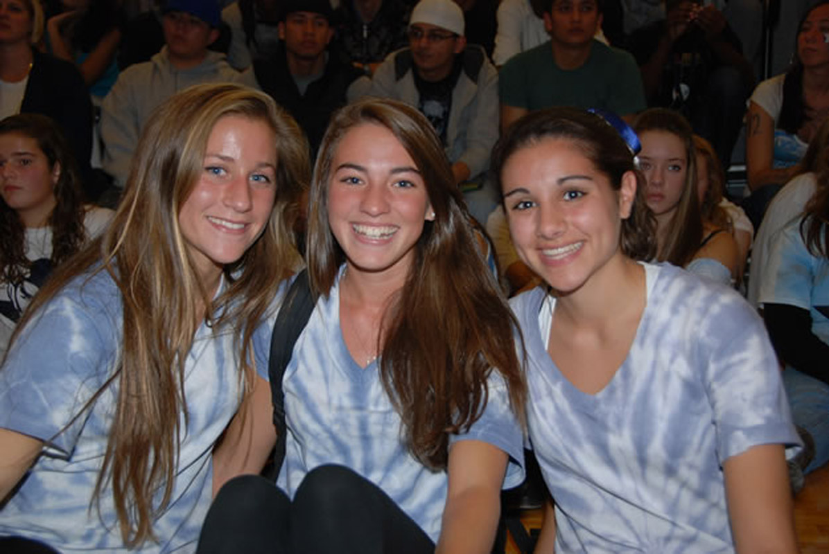 Courtney O'Bryan (center) is flanked by Sarah Ehrman (left) and Cristina Badalamenti at Huntington's 2010 pep rally.