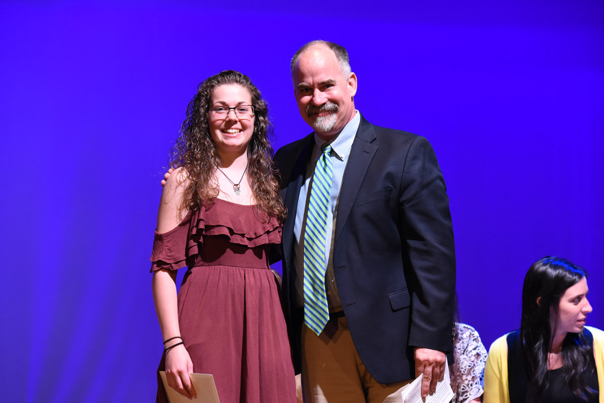 Huntington alum Chris Williams presented Christina Varady with the Alan Kuver Memorial Scholarship 