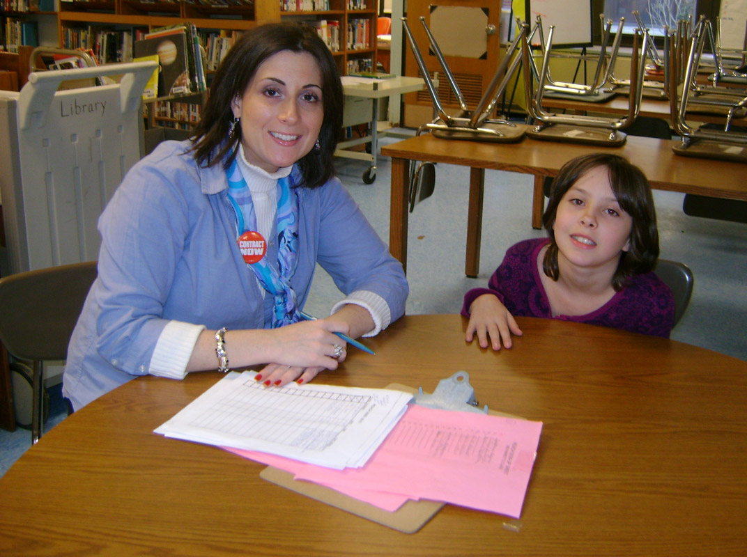 Huntington librarian Christine Amodeo Palmer works with a student