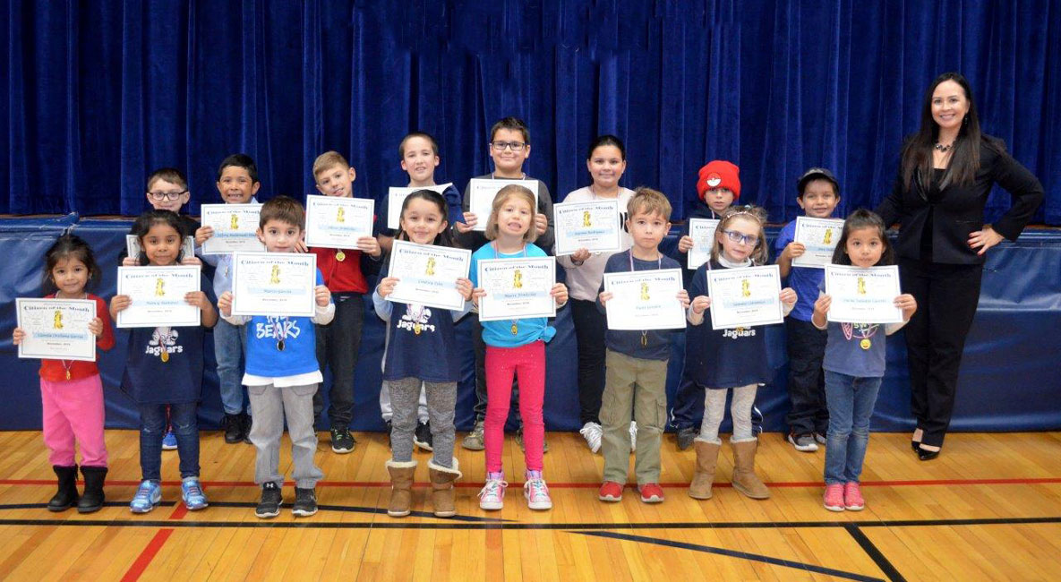 Jefferson Principal Valerie Capitulo-Saide with November's Citizens of the Month.