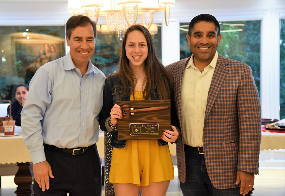 Legal advisors John LoTurco and Xavier Palacios with the Huntington mock trial team's Rookie of the Year Lia Shechter.