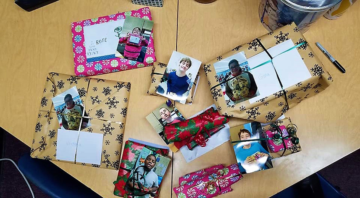 The Finley students wrapped the gifts they had purchased and attached a card and photo to the package 
