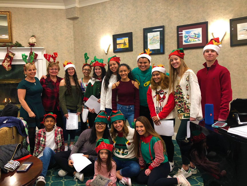 Huntington High School Grandfriends club membes sang carols at Huntington Atria.