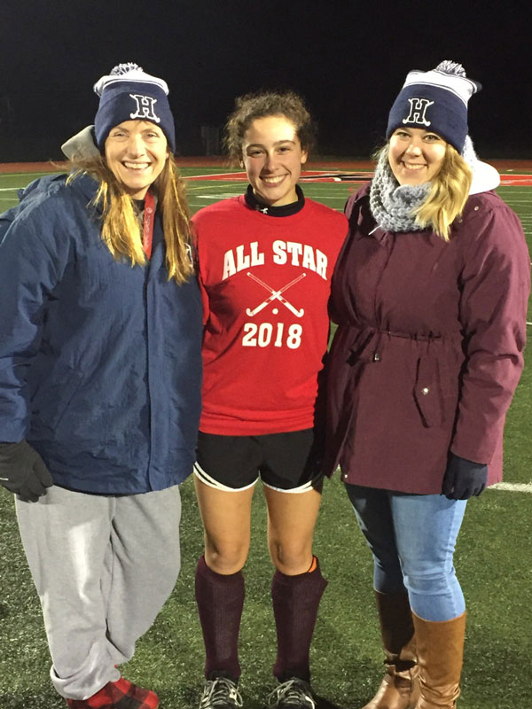 Morgan Minicozzi is flanked by Huntington coaches Kathy Wright and Allison Conlon at the Suffolk All-Star game at Patchogue-Medford.
