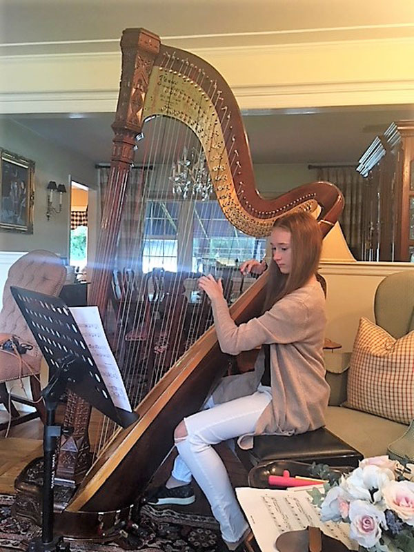 Freshman Mary Grace Rorke is believed to be Huntington's first harpist.