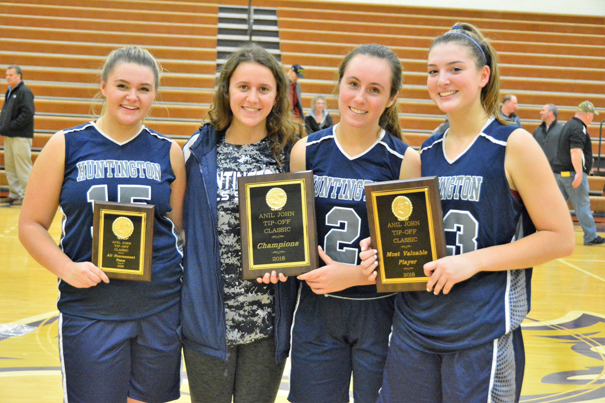Christie Baade, Alyssa Sorensen, Paige Lennon and Abby Maichin show off Huntington's awards after winning the Islip tournament.