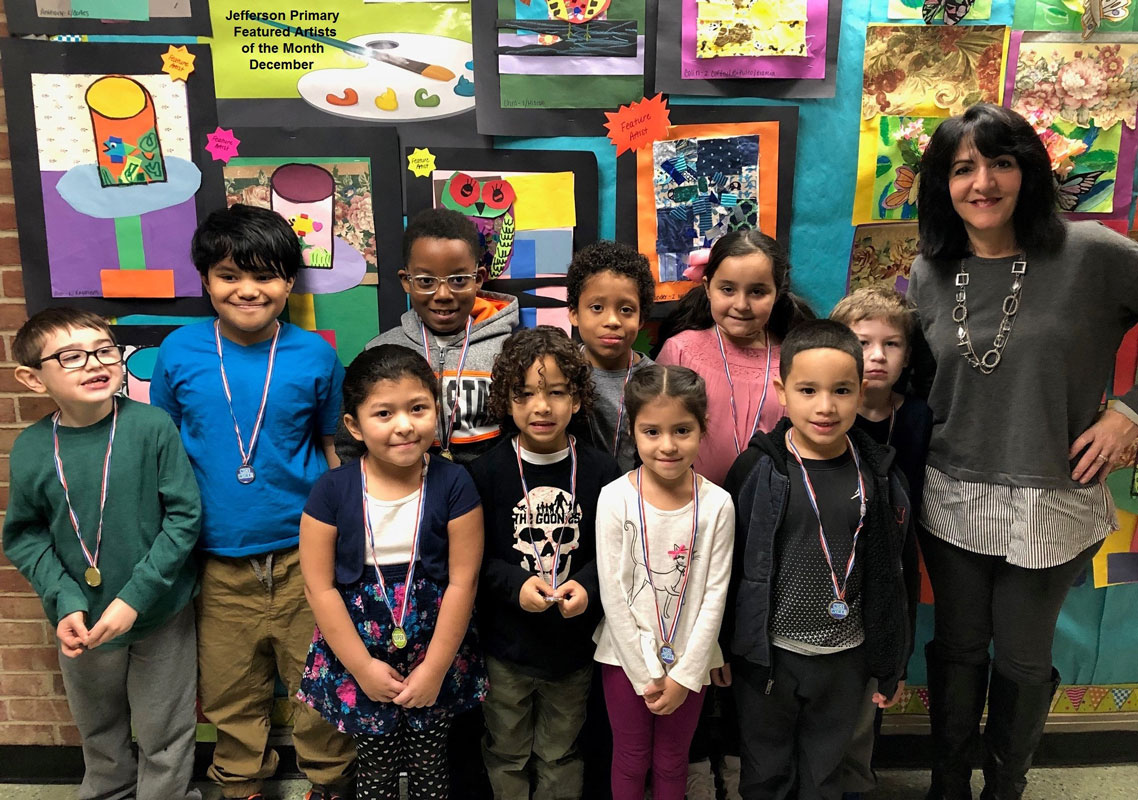 Art teacher Maria Mazzola with Jefferson School's Featured Artists for December.