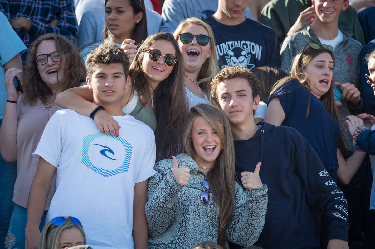 Caroline Lenze gives the thumbs up sign with her friends at Blue Devil Stadium. (Darin Reed photo.)