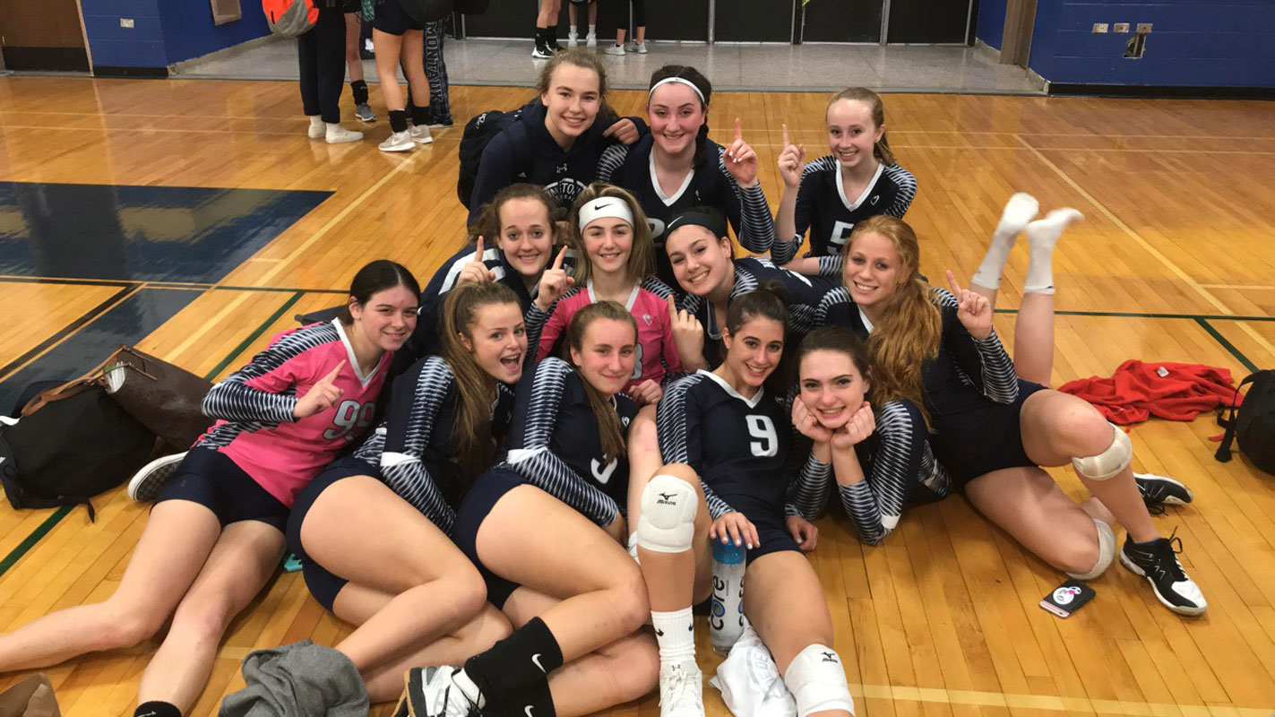 Steli Vlahos (No. 9) with her Blue Devil varsity volleyball teammates. (Darin Reed photo.)