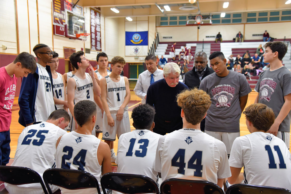 Huntington boys' basketball head coach Brian Carey tries to inspire his players.