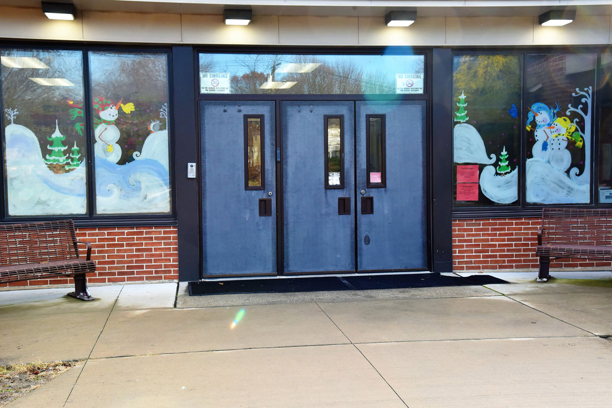 Teacher aide Terry Moreno created a winter holiday display in the Washington School main entrance windows. 