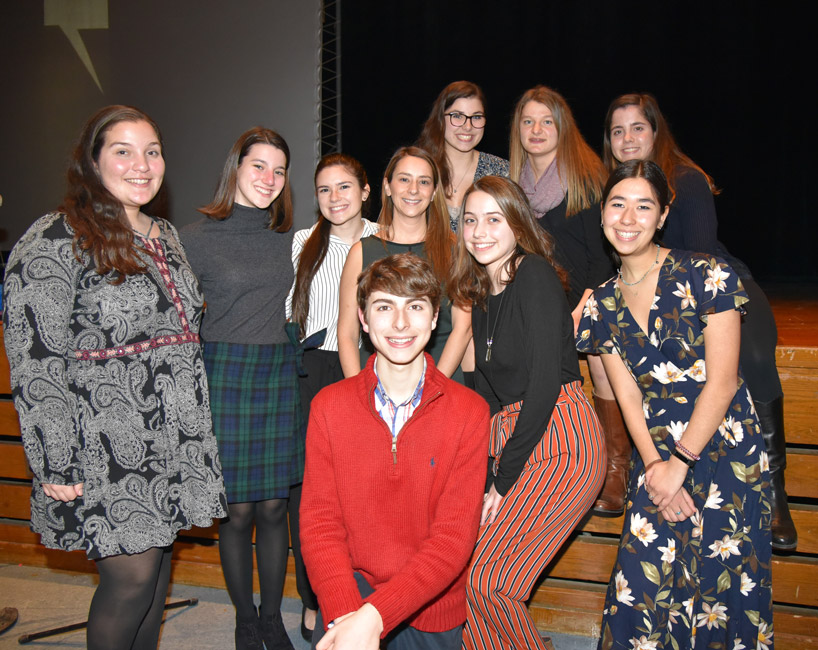 Teacher Lauren Desiderio is surrounded by the History Day club executive board
