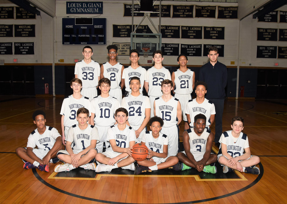 The Huntington boys' junior varsity basketball team with head coach Patrick Reilly.