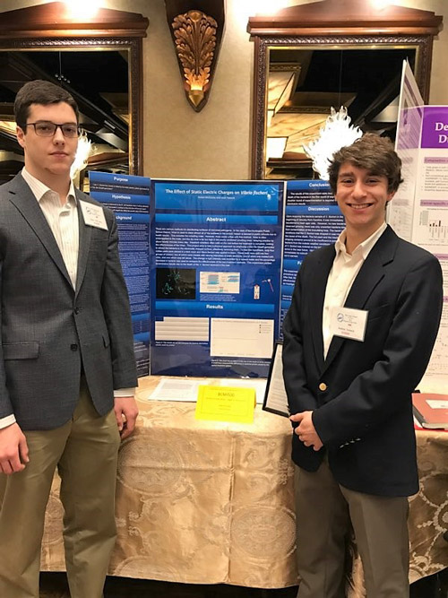 Aidan McCooey and Josh Yanuck with their research presentation board at Crest Hollow.